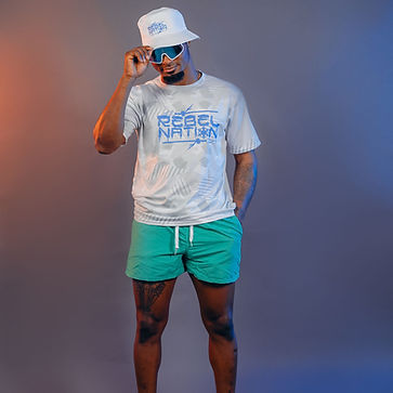 Rebel Nation male model in teal shorts